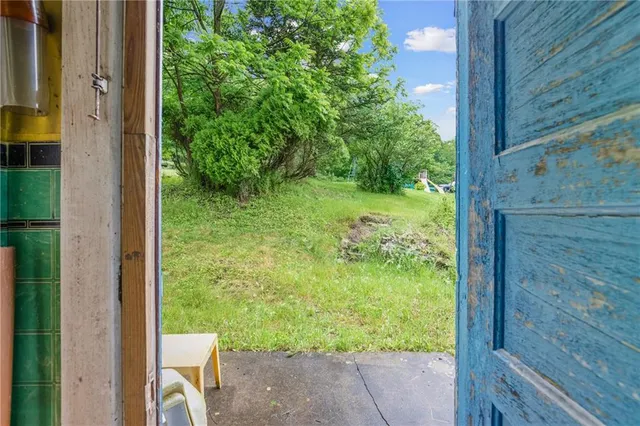 a view of a porch with a yard