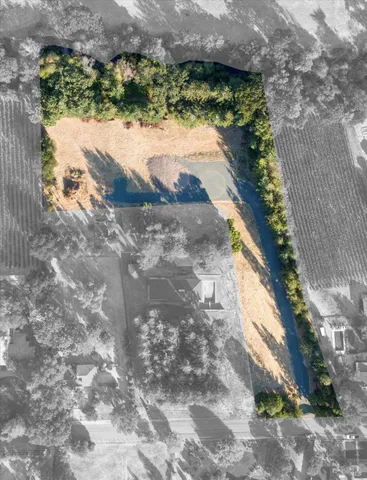 a view of a lake with a yard