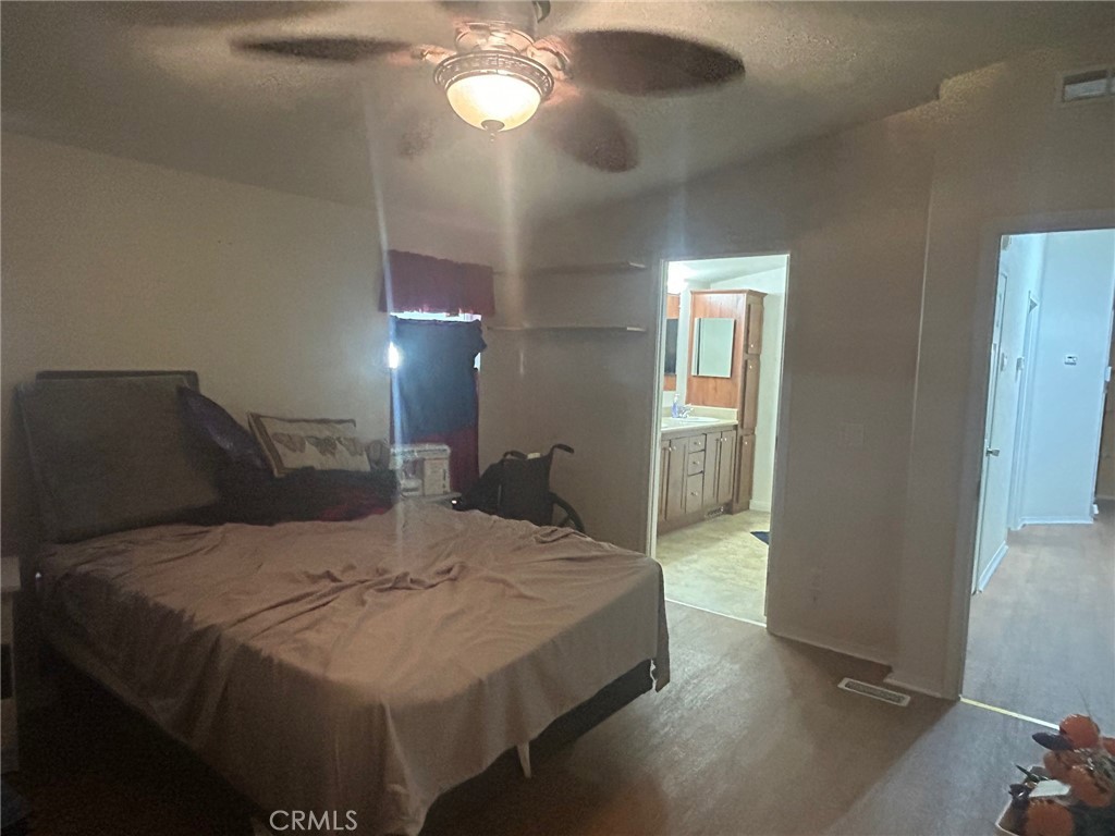 2300 Lewis Street Anaheim, CA 92802 - Photo 9 of 14 Huge master suite. The bed, like many quality furniture pieces will remain should the buyers' agent ask in their offer