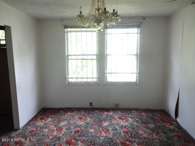 2829 Fleming Street Jacksonville, FL 32254 - Photo 6 of 11 a view of a big room with windows and chandelier