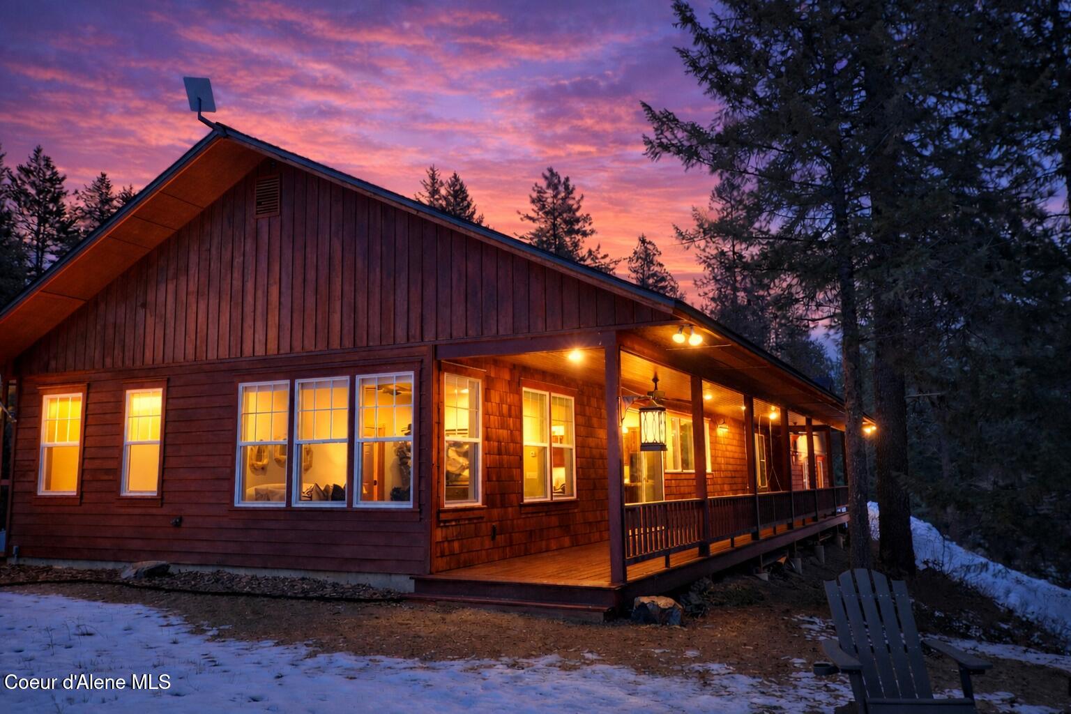 672 Hopkins Road Sandpoint, ID 83864 - Photo 72 of 72 Twilight glow on a snowy cabin