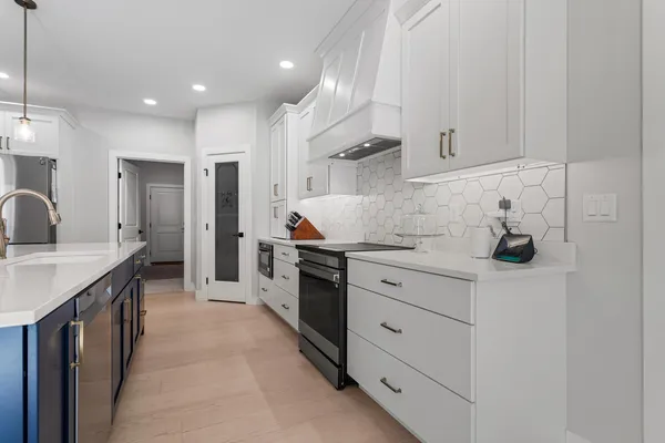 a kitchen with cabinets and sink