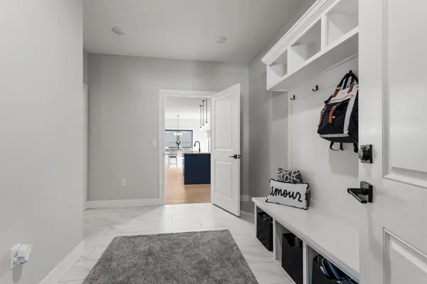 a kitchen with stainless steel appliances kitchen island a refrigerator sink and cabinets