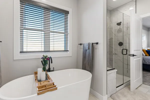 a bath tub sitting next to a white sink