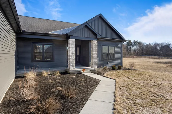 a front view of a house with a yard