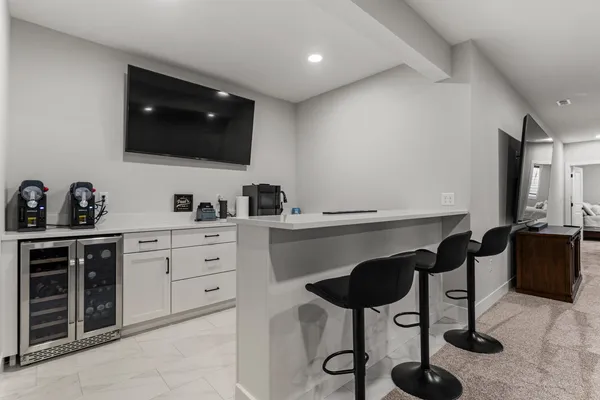 a kitchen with stainless steel appliances kitchen island granite countertop a sink and cabinets
