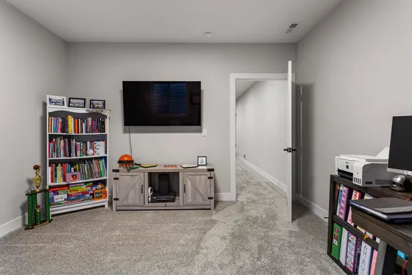 a bathroom with a sink a toilet and shower curtain