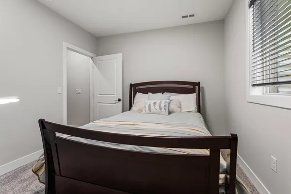 a view of a storage room with furniture gym equipment and windows