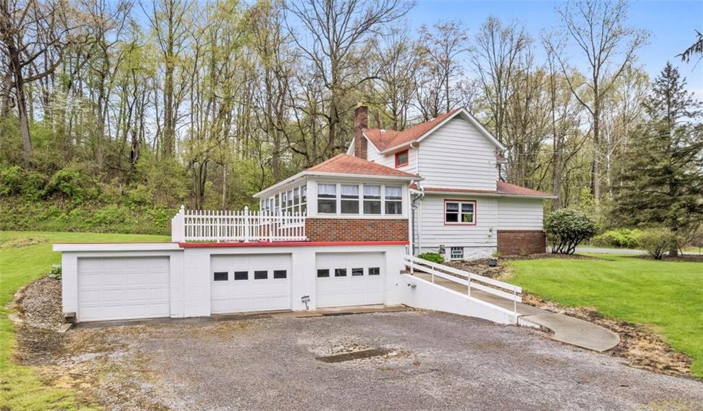 6438 Wampum Mt Air Road Wampum, PA 16157 - Photo 2 of 42 a view of a house with a yard and large trees