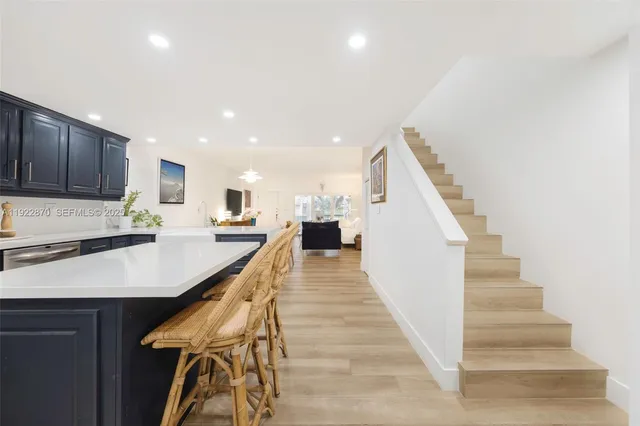 a view of kitchen with cabinets and wooden floor
