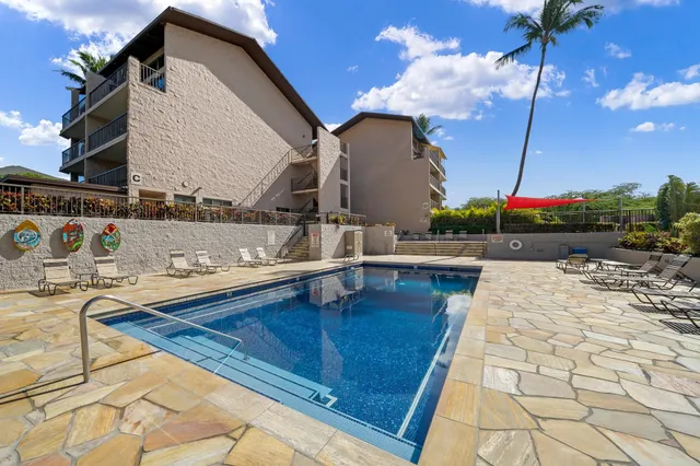 a patio with a yard table and chairs