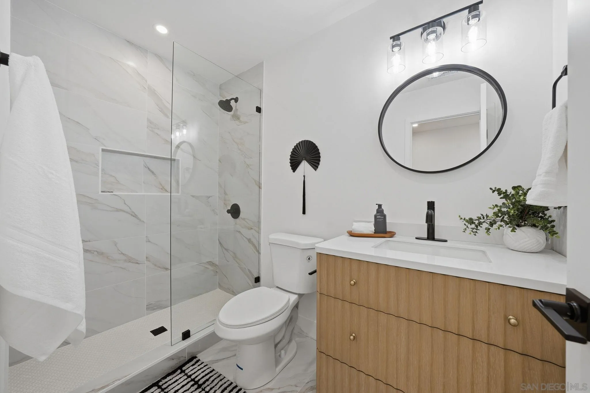 10440 Bosque Drive Lakeside, CA 92040 - Photo 41 of 47 a bathroom with a sink a toilet and shower