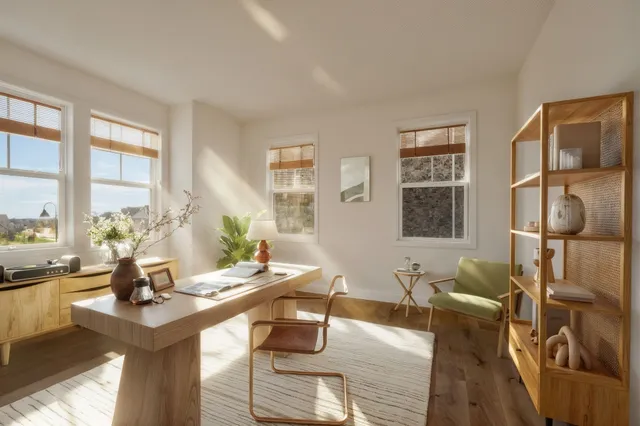 a living room with furniture and next to a window