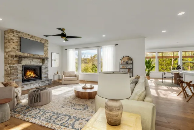 a living room with furniture and a fireplace