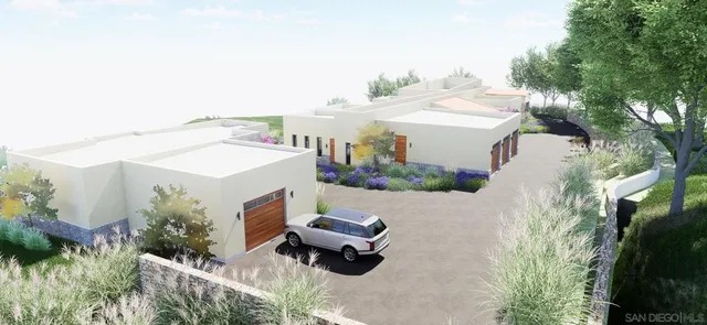 an aerial view of a house with yard and outdoor seating