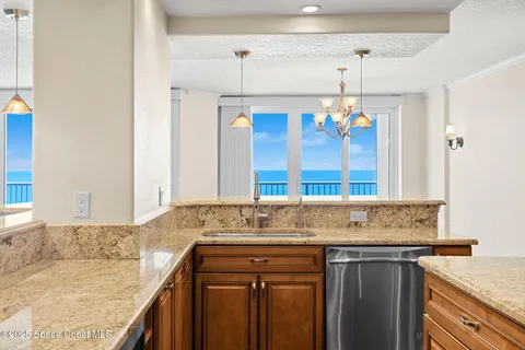 a bathroom with a granite countertop sink a mirror and a shower