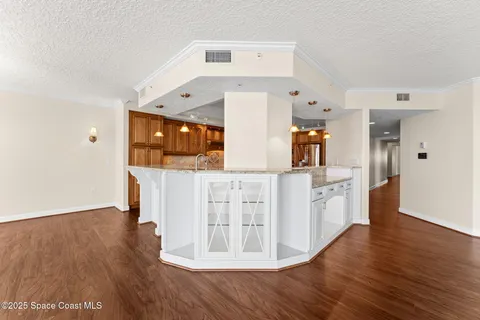 a view of a kitchen with wooden floor