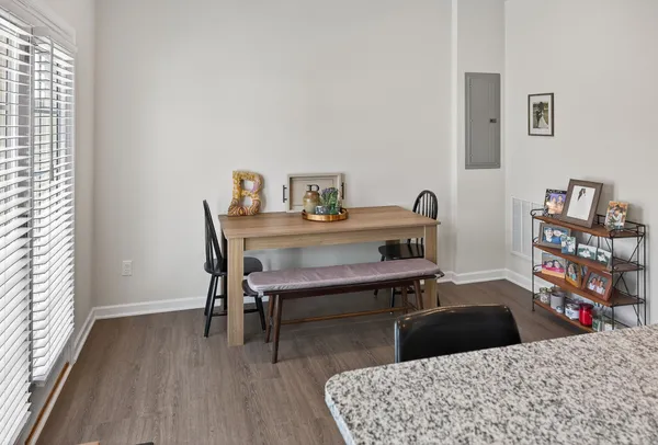 a bedroom with a bed and a bookshelf with wooden floor