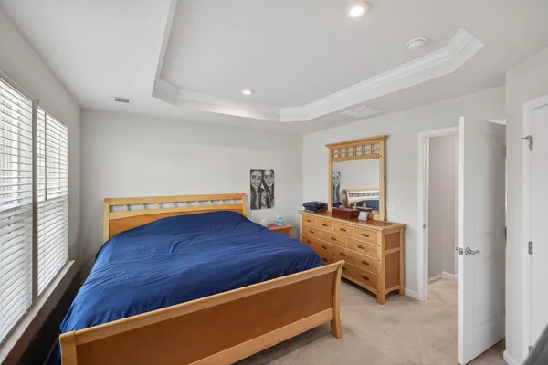 a bed room with a bed and window