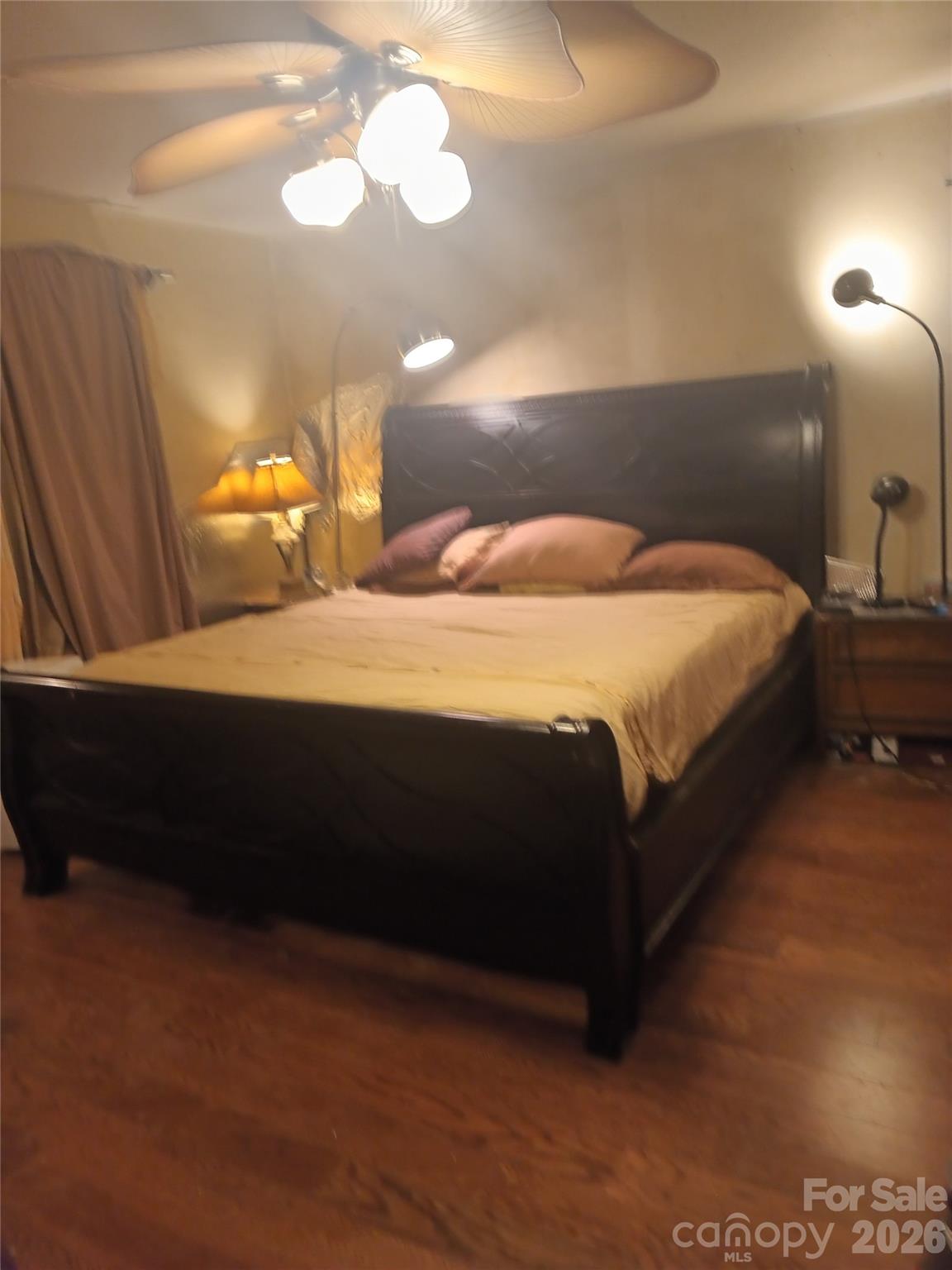 746 Sinclair Drive Monroe, NC 28112 - Photo 4 of 12 a bedroom with a bed and a lamp with window