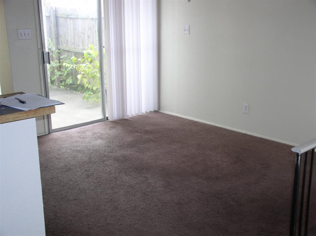 7210 Pineberry Road Dallas, TX 75249 - Photo 3 of 8 a view of a room with a window