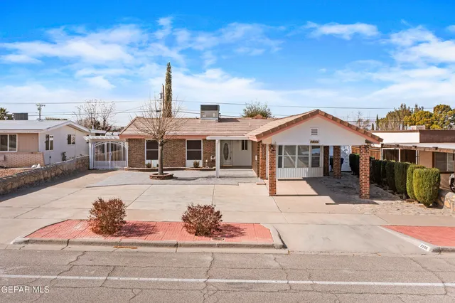 a front view of a house with yard porch and seating space