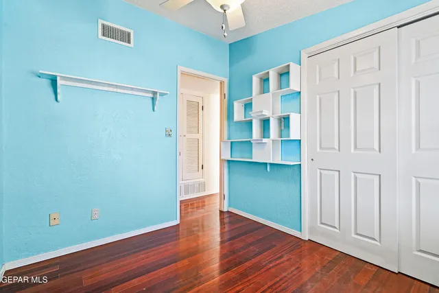 a bathroom with a sink mirror vanity and toilet