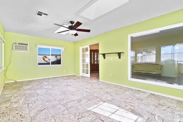 a view of a backyard with sitting area