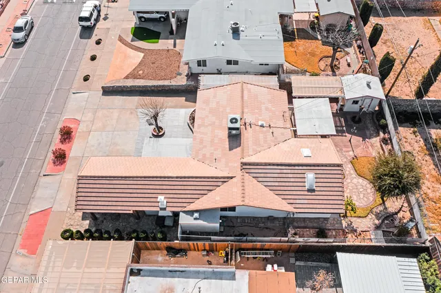 an aerial view of residential houses with outdoor space