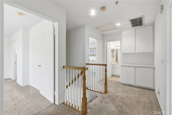 a view of a hallway with closet area