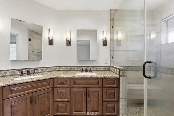 a bathroom with a sink and mirror