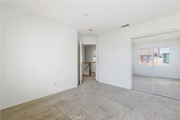 an empty room with a bathroom