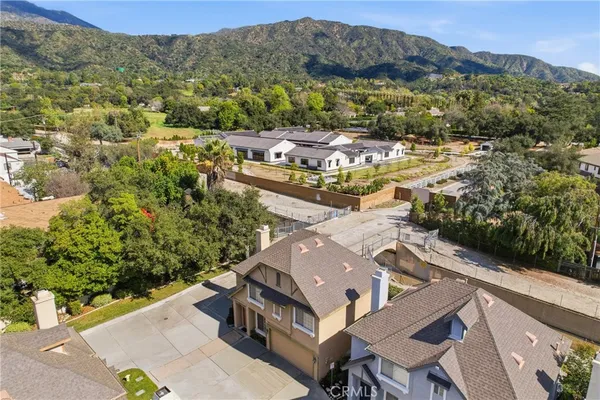 an aerial view of residential building with green space