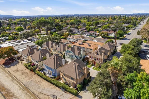 an aerial view of residential houses with outdoor space