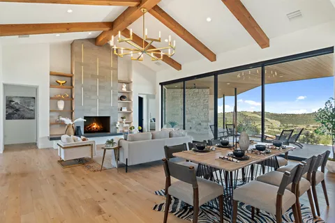 a view of a livingroom with furniture and a fireplace