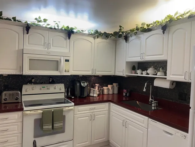 a kitchen with a cabinets and a stove