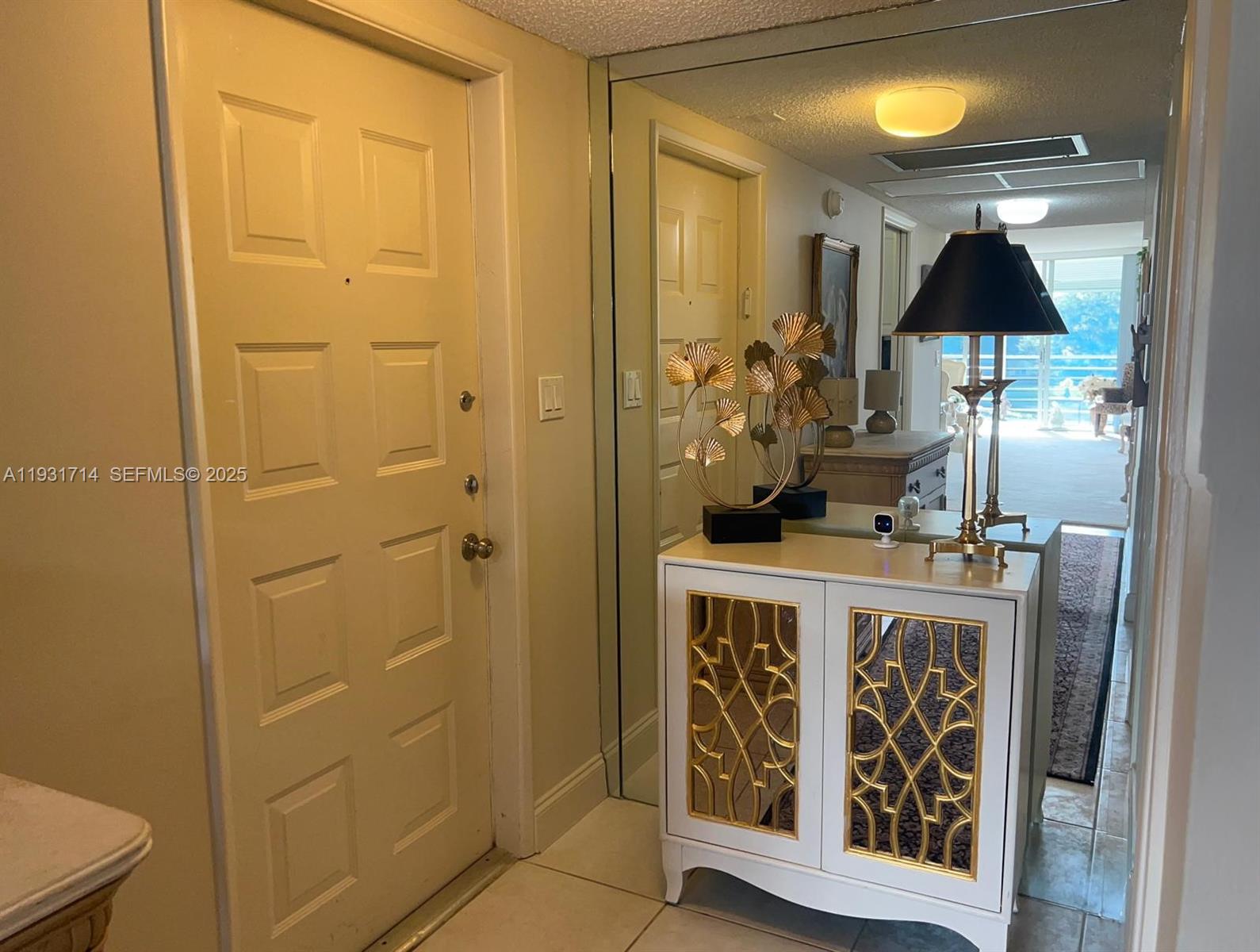821 Cypress Boulevard, Unit 312 Pompano Beach, FL 33069 - Photo 22 of 52 a bathroom with a sink a mirror and a shower