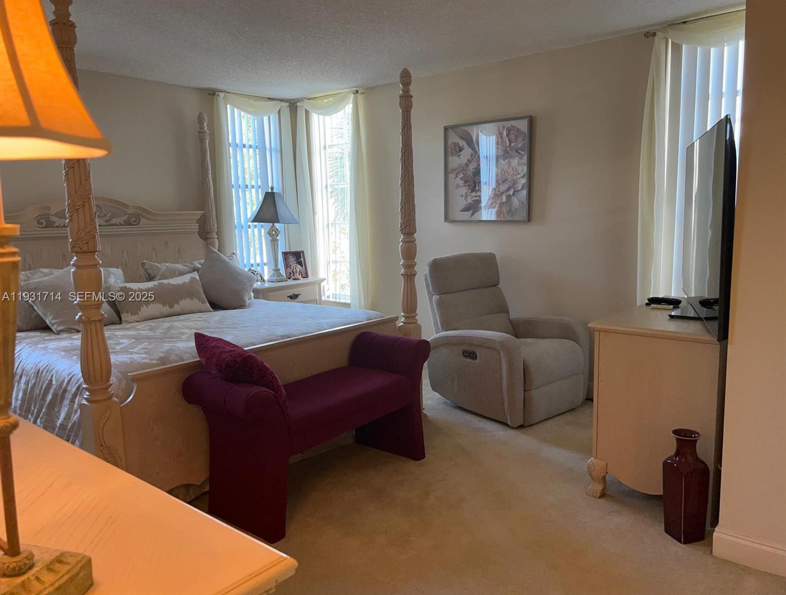 821 Cypress Boulevard, Unit 312 Pompano Beach, FL 33069 - Photo 26 of 52 a living room with furniture and a window