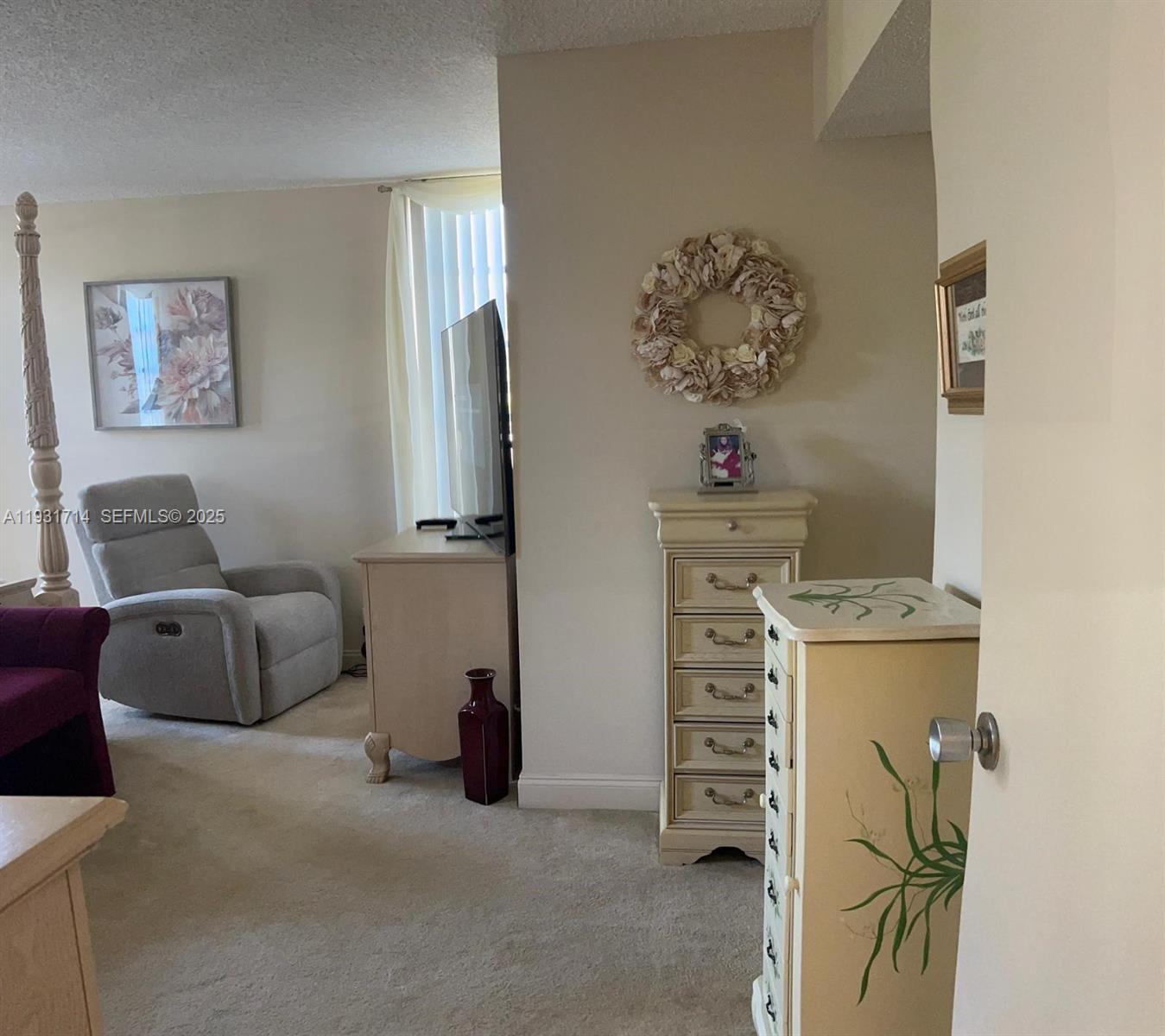 821 Cypress Boulevard, Unit 312 Pompano Beach, FL 33069 - Photo 28 of 52 a room with a couch and a window