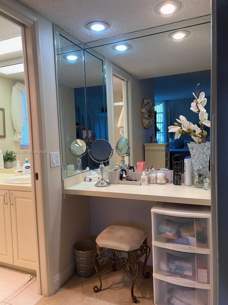 821 Cypress Boulevard, Unit 312 Pompano Beach, FL 33069 - Photo 34 of 52 a room with stainless steel appliances kitchen island granite countertop furniture and a view of living room