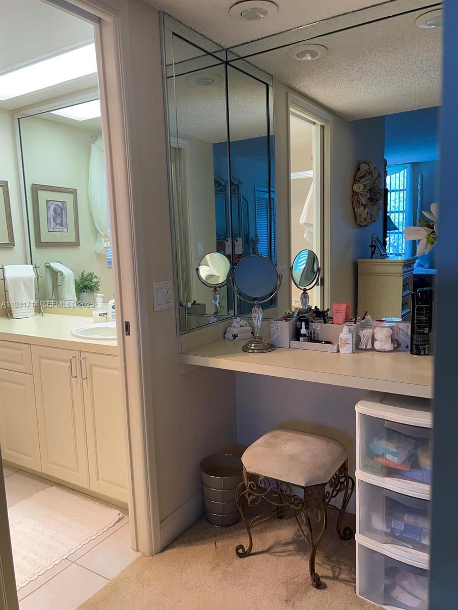 821 Cypress Boulevard, Unit 312 Pompano Beach, FL 33069 - Photo 36 of 52 a view of a sink and chair in a room