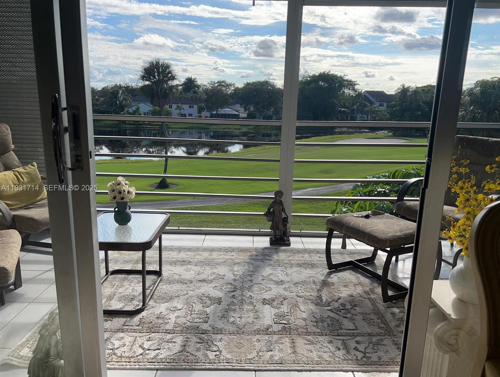 821 Cypress Boulevard, Unit 312 Pompano Beach, FL 33069 - Photo 47 of 52 a view of a bench in the back yard