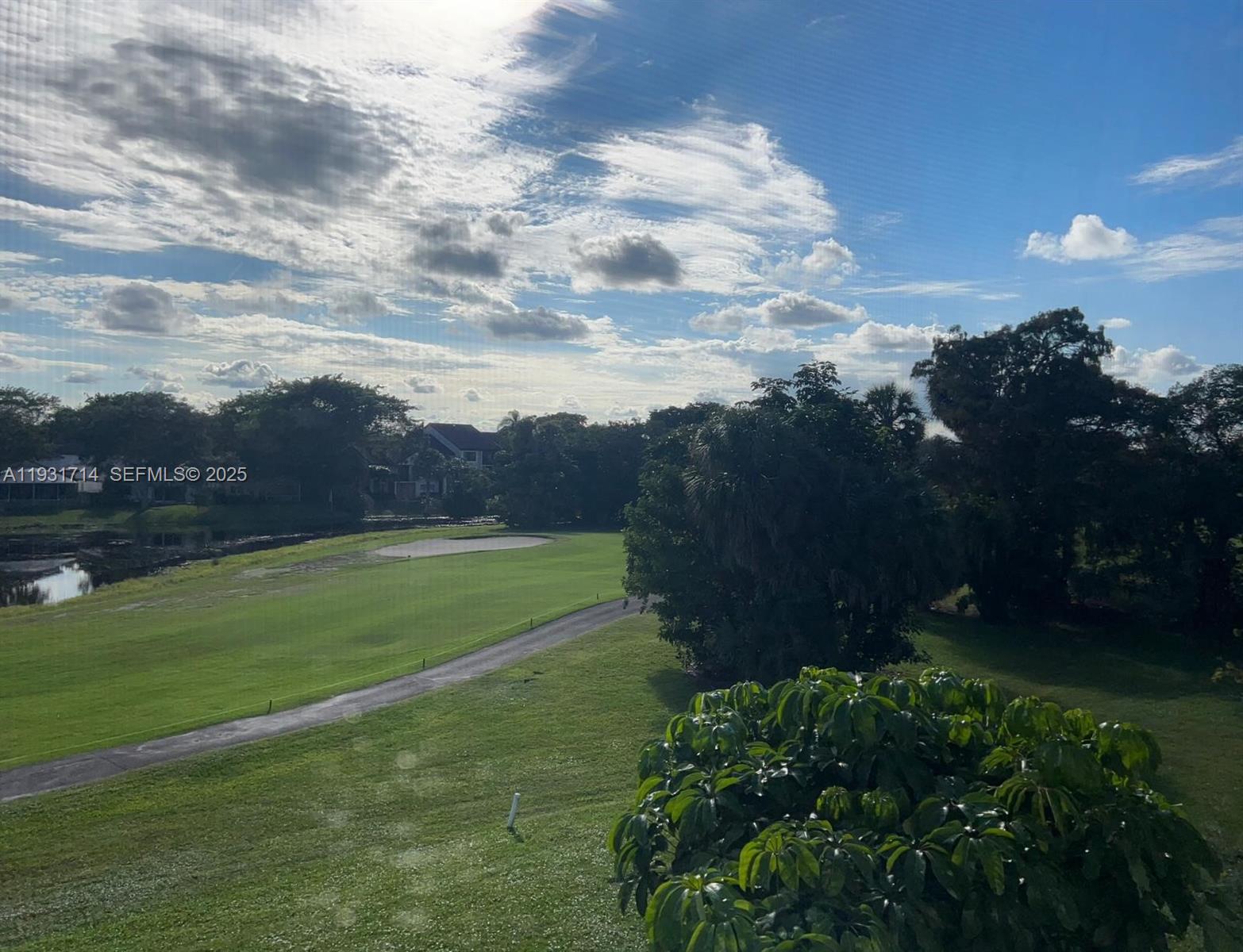 821 Cypress Boulevard, Unit 312 Pompano Beach, FL 33069 - Photo 51 of 52 a view of a yard and front view of a house