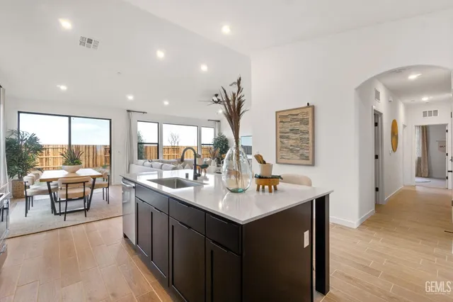 a view of a living room and kitchen