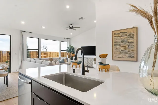a kitchen with a sink and cabinets