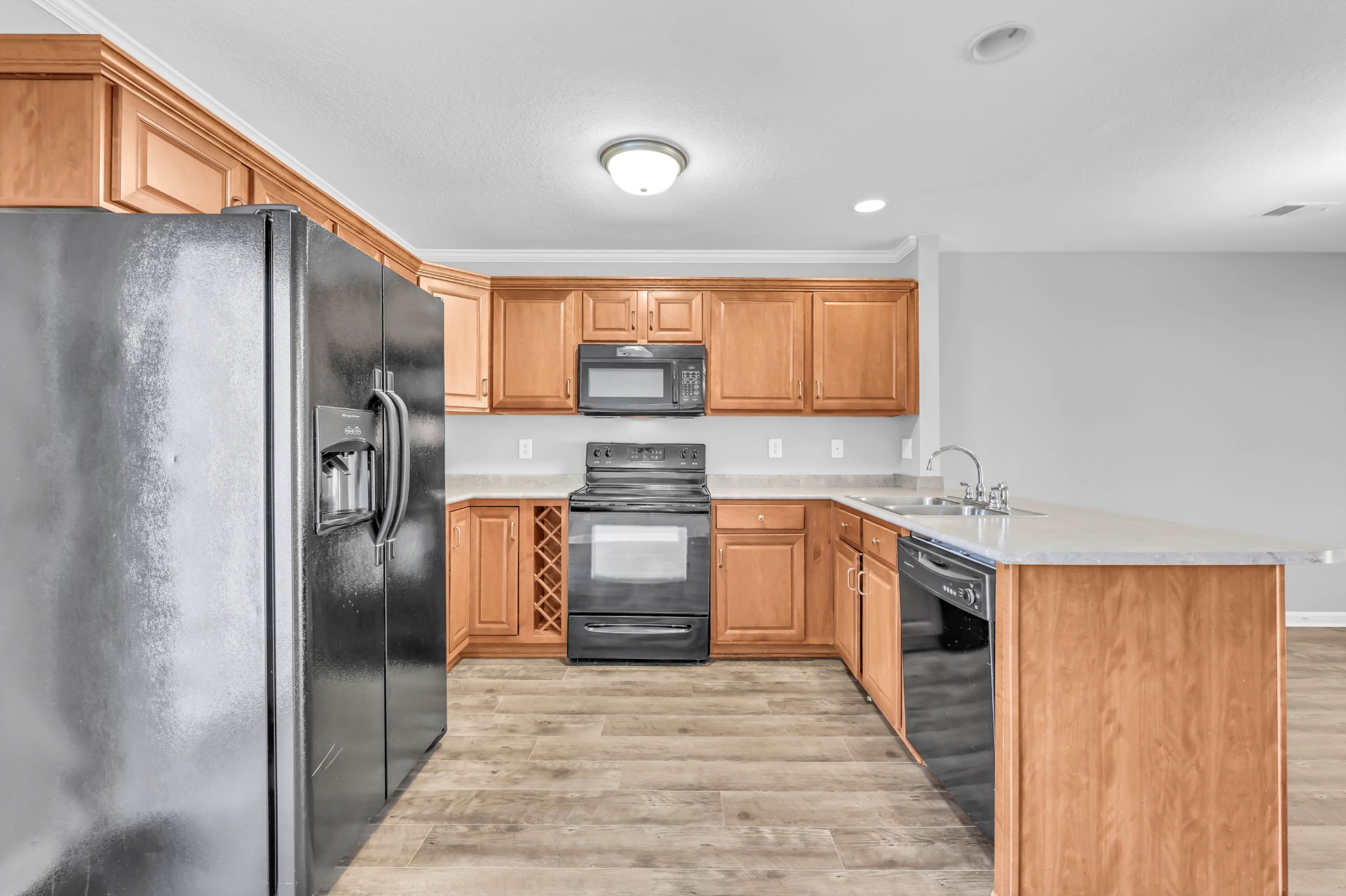 116 Alexander Boulevard Clarksville, TN 37040 - Photo 11 of 33 a kitchen with stainless steel appliances granite countertop a refrigerator a sink a stove and island