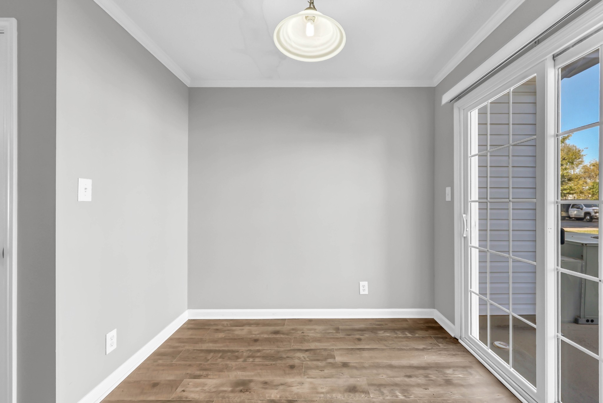 116 Alexander Boulevard Clarksville, TN 37040 - Photo 15 of 33 an empty room with wooden floor and windows