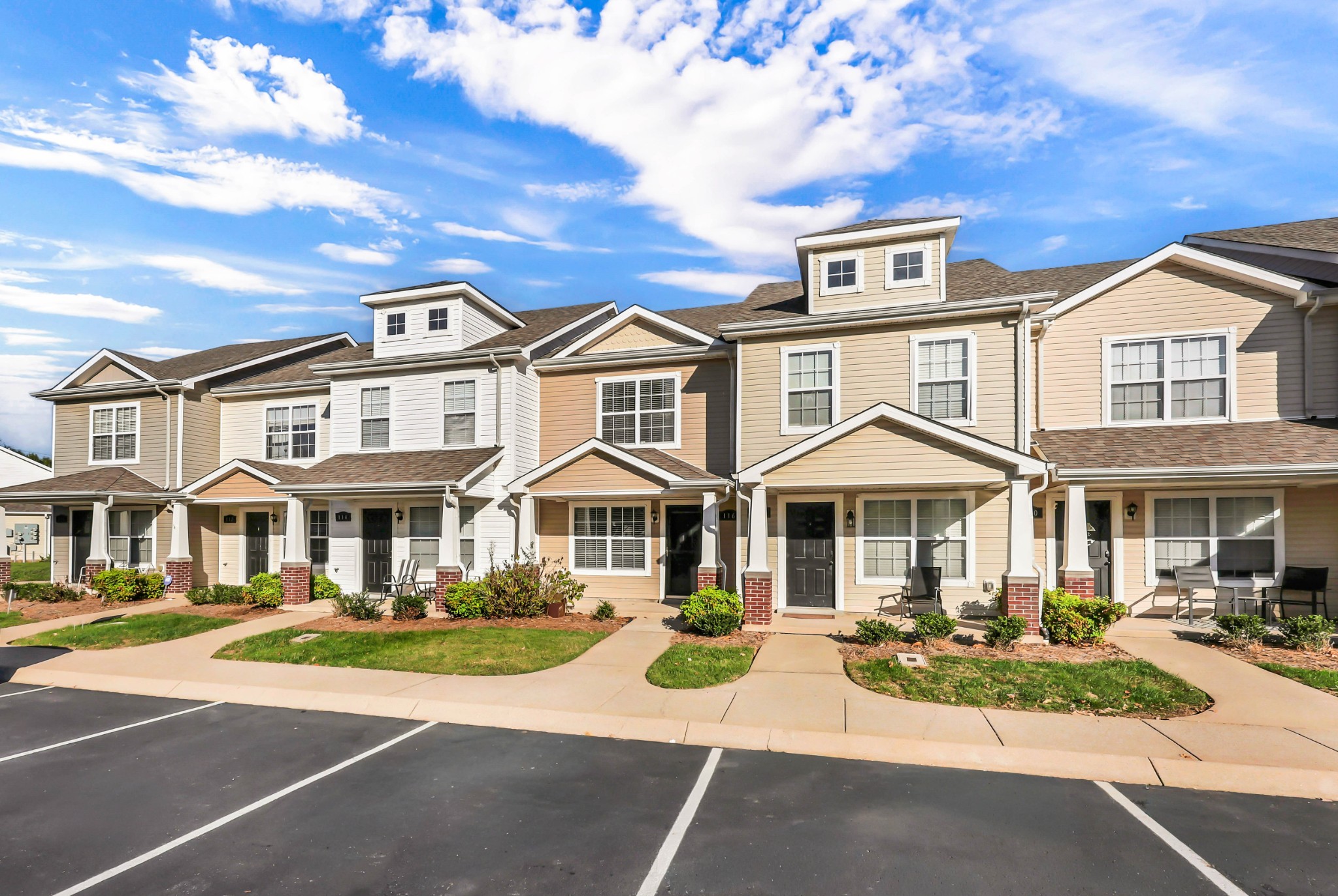 116 Alexander Boulevard Clarksville, TN 37040 - Photo 29 of 33 a front view of a residential apartment building with garage and yard