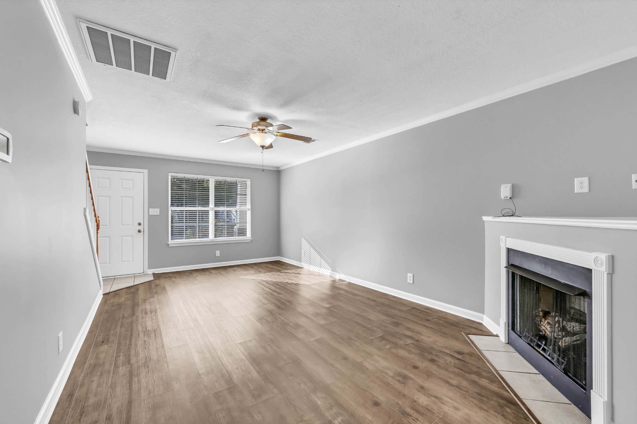 116 Alexander Boulevard Clarksville, TN 37040 - Photo 4 of 33 a view of an empty room with wooden floor fireplace and a window