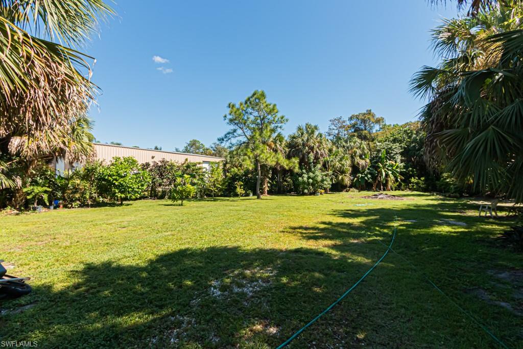 740 31st Street Southwest Naples, FL 34117 - Photo 11 of 50 a view of a golf course with a lake